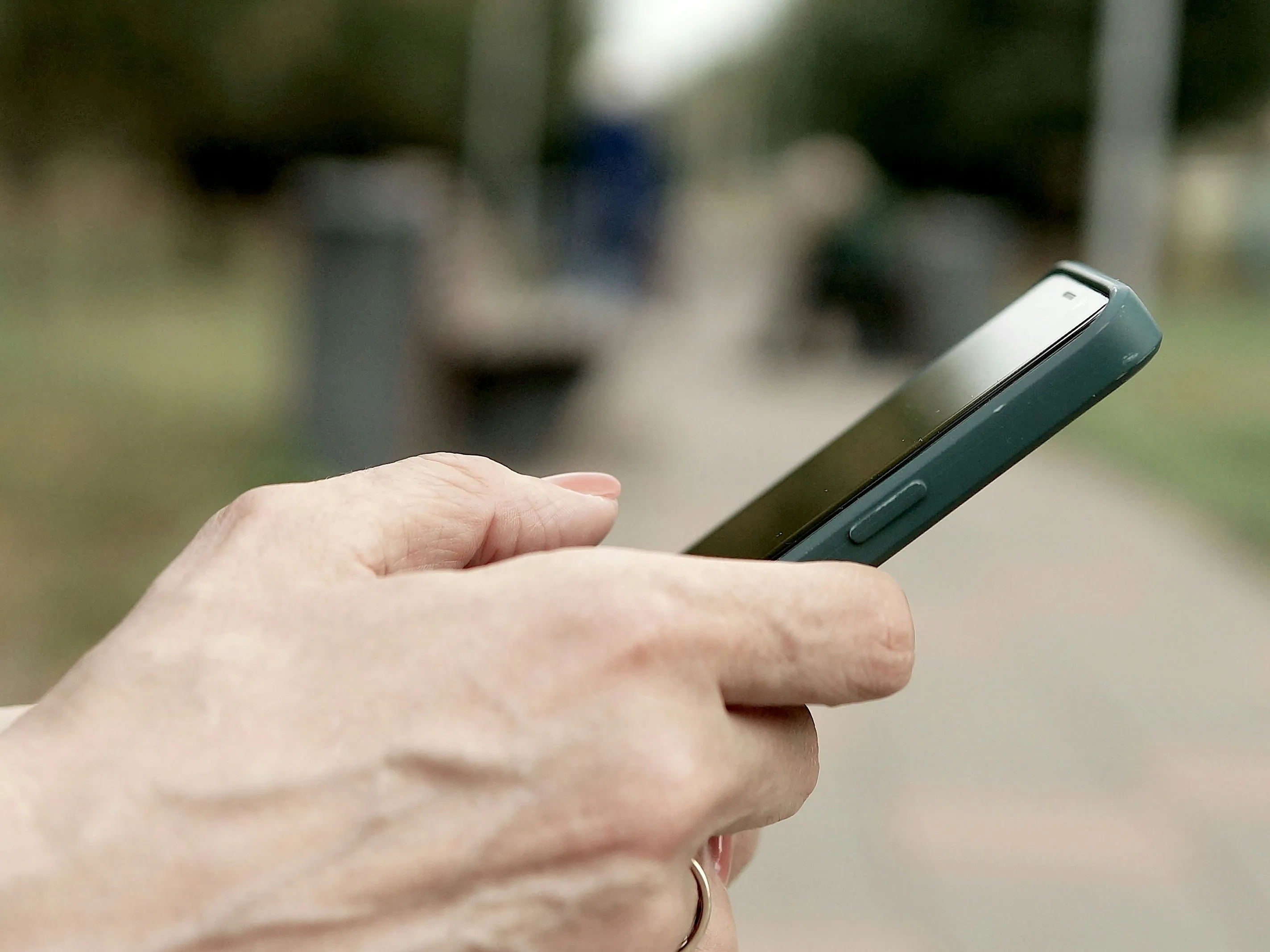 A closeup of a woman's hands holding a smartphone